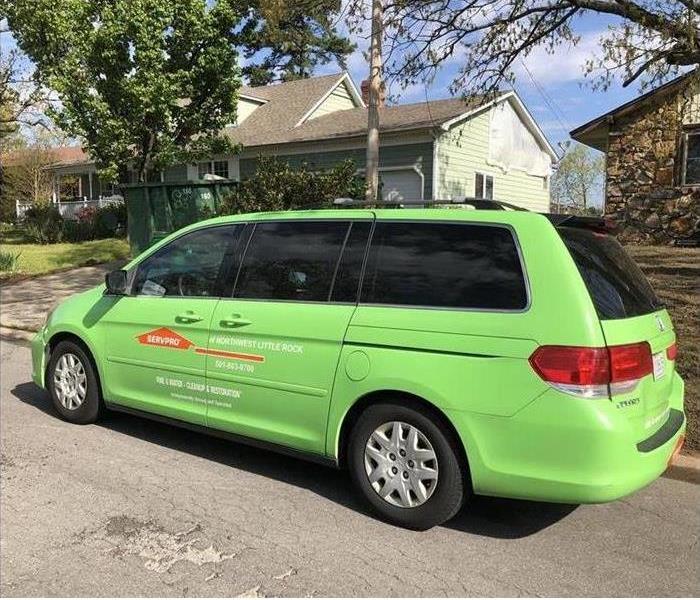 SERVPRO car parked in front of home