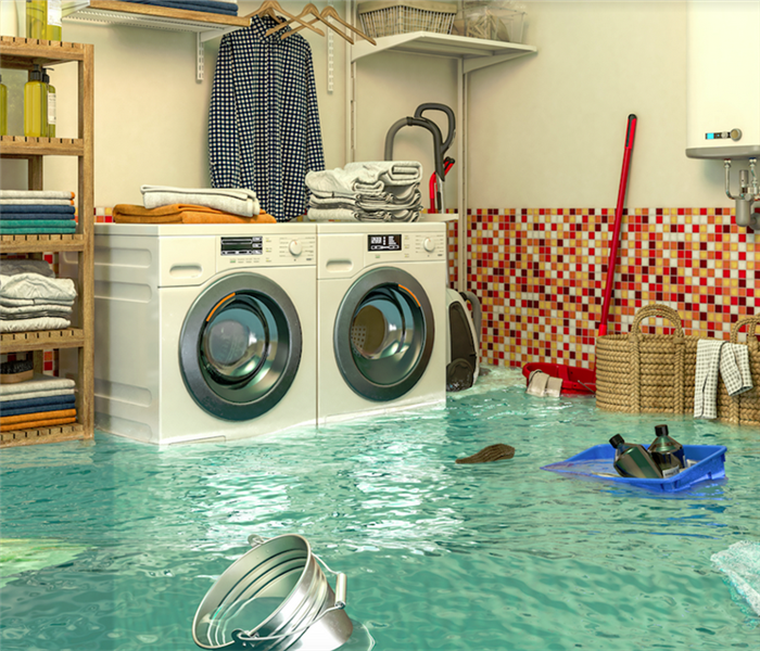 a flooded laundry room with water everywhere